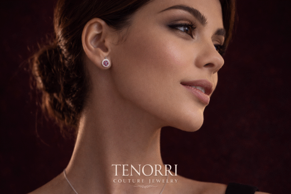 Elegant woman wearing TENORRI ruby halo stud earrings