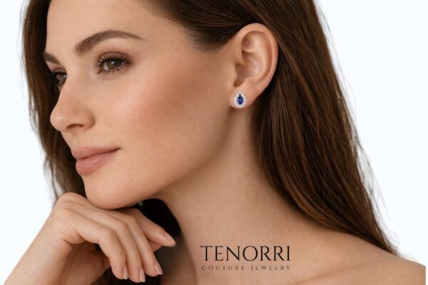 Elegant woman wearing TENORRI sapphire diamond earrings